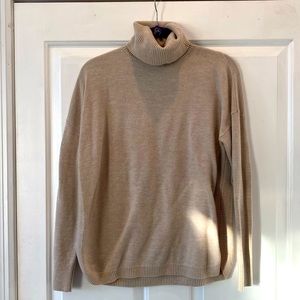 Tan oversized turtleneck sweater